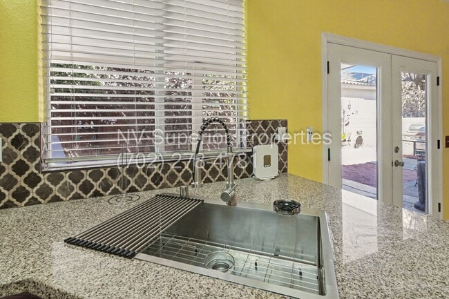Building Photo - NW!! 4 Bedrooms!!! All Tile and Pergo flooring T/O!! NO Carpet!!! Low Maintenance Desert landscap...