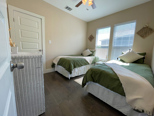 Guest bedroom showing walk-in closet and two extra long twin beds. - 422 S Olive St