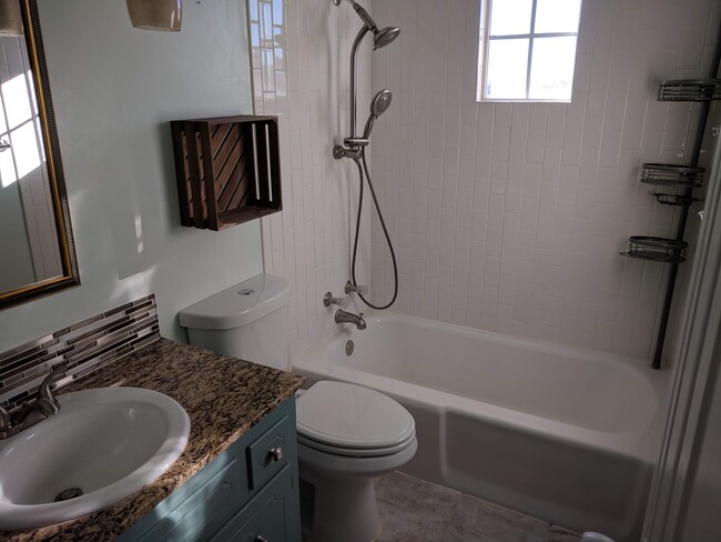 2nd floor bathroom with granite countertop - 8716 E 47th Pl