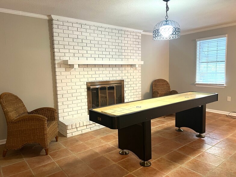 Den with oh my gosh fireplace and game table - 902 Penn Waller Rd