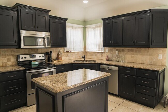 Building Photo - POOL - Elegant 4-Bedroom Home with Fenced Yard