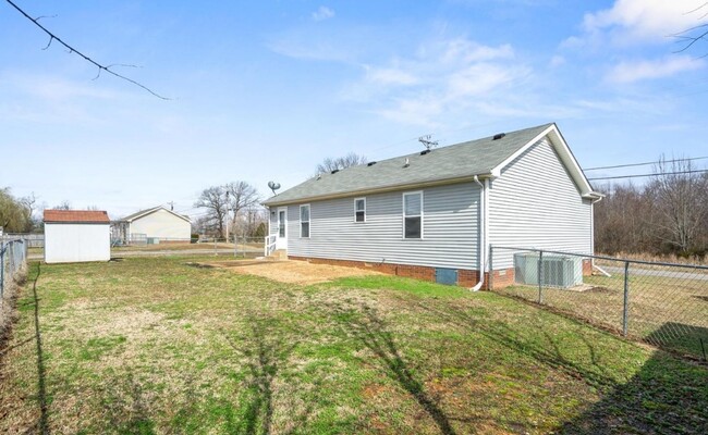 Building Photo - Fenced Backyard with a Shed!