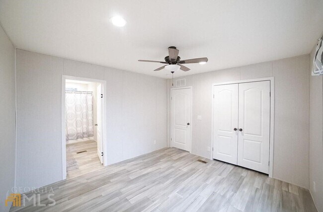 Building Photo - Spacious 4-Bedroom Home with Lawn Maintena...