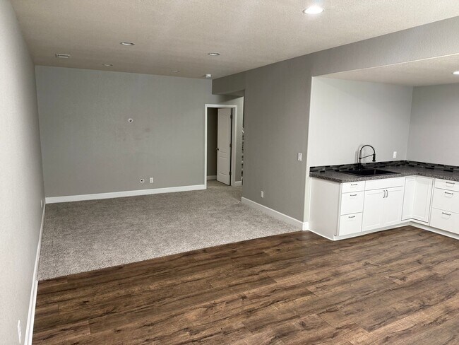 Building Photo - Greenbelt-Backed Wheatlands Home - Mountain Views, 3 Car Garage & Finished Basement