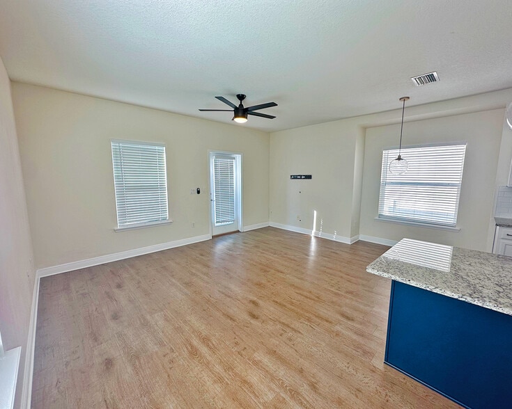 Bright living room featuring tall ceilings, modern finishes, and an open l - 1736 W Walnut St