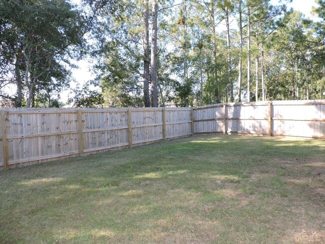 Building Photo - Almost new four bedroom home with solar pa...