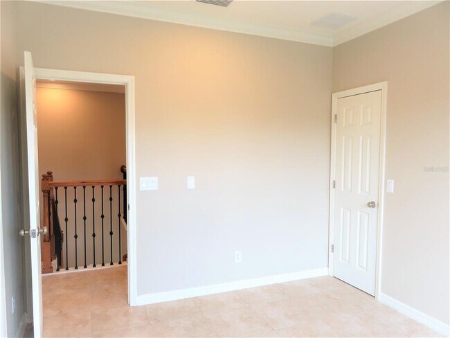 Building Photo - 8828 Tropical Palm Dr