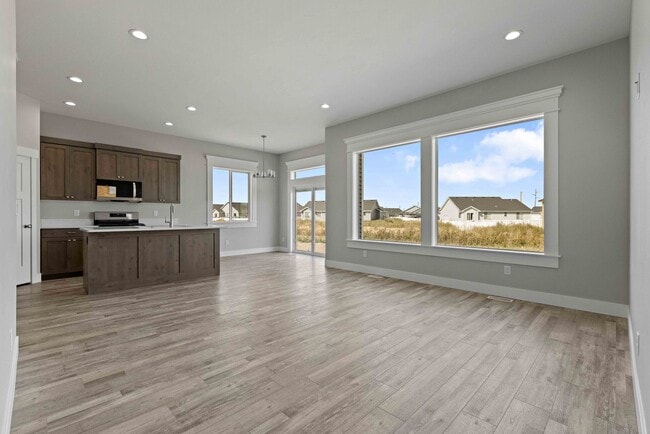 Building Photo - NEW HOME with large garage stalls and unfinished basement for additional storage