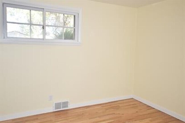 Building Photo - Updated house with original hardwoods and 2-car garage!