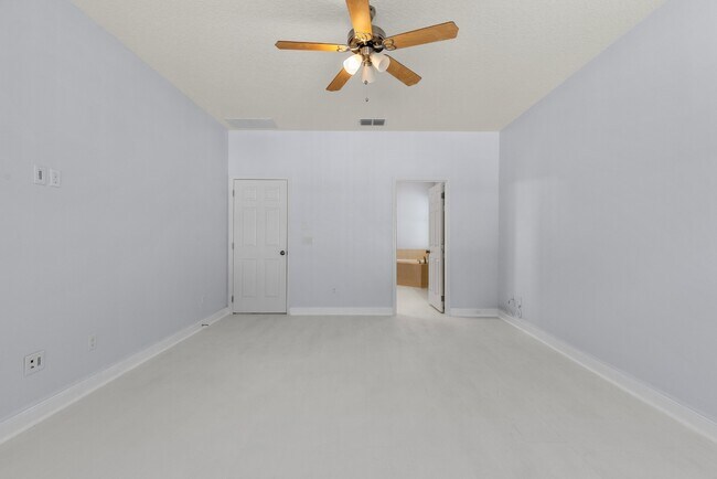 Building Photo - Spacious 6-Bedroom Home Near Lake Nona | 3-Car Garage + Tesla Charger