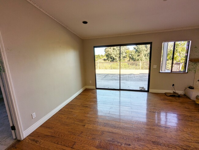 Family room with entrance to large deck - 3972 Ecochee Ave