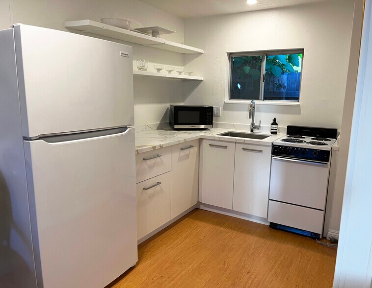 Renovated kitchen with new appliances, countertop, and sink - 1795 San Pasqual St