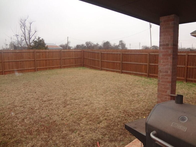 Cement slab in backyard makes it easy to cookout. - 1233 Red Rock Drive