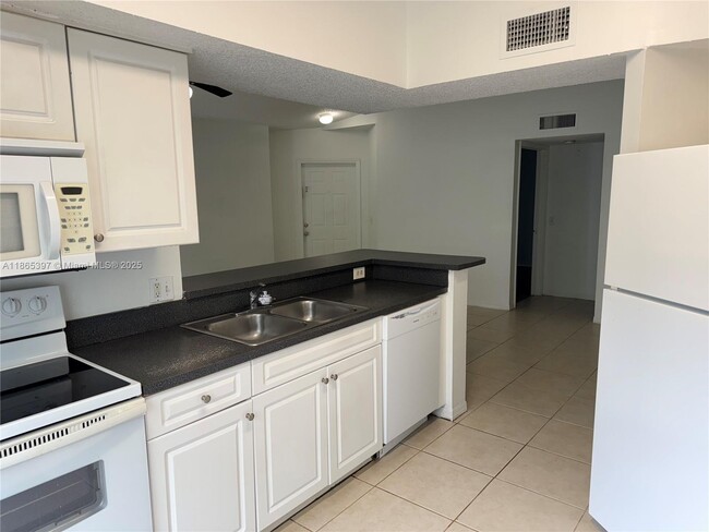 Building Photo - $2,400MONTHLY;9615 NW 1ST CT #10-301 PEMBR...