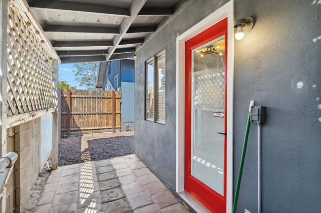 Back patio which leads to the laundry area or to the private backyard! - 327 N 16th Ave