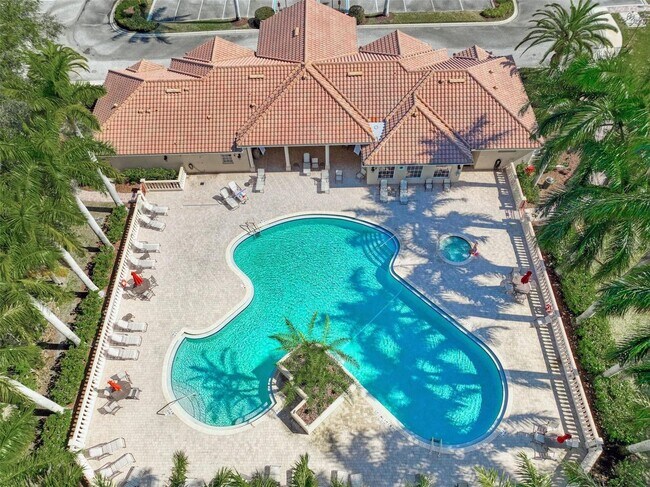 Building Photo - Elegant 3 Bedroom End-Unit Condo with Screened Lanai & Pond Views and A Private Garage