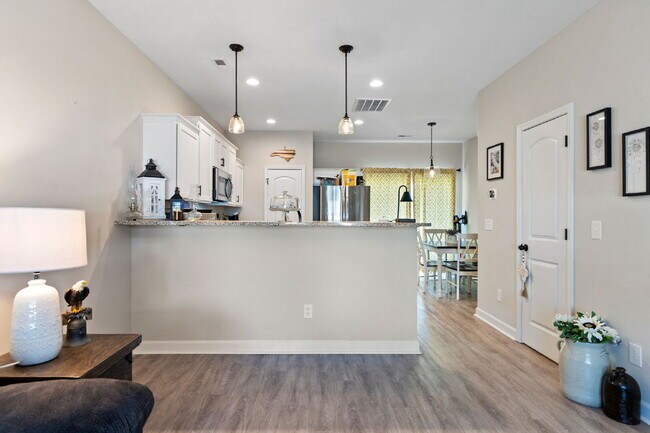 Building Photo - Available Now! Enjoy low-maintenance coastal living in this beautiful 2-bedroom, 2.5-bath townhom...