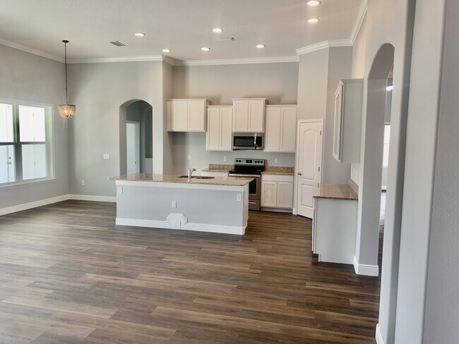 Building Photo - "Spacious 4-Bedroom 3-Bath with In-Law Suite & Granite Finishes in Palm Bay!"