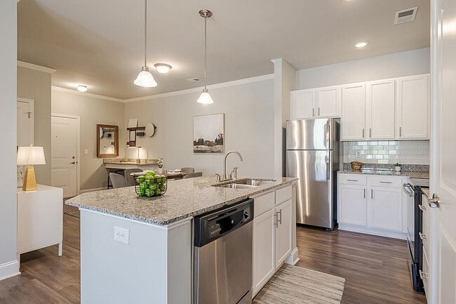 Experience the charm of this sleek kitchen, designed for culinary adventures and cozy dining moments. - Sanctuary at Powell Place