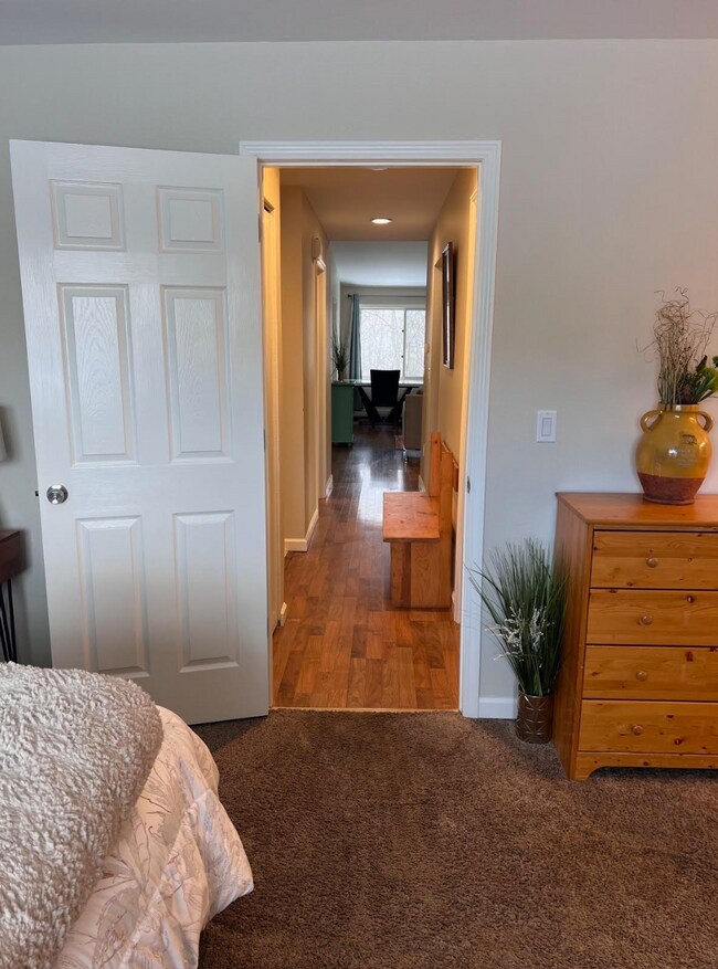 Master bedroom looking down hallway into living area - 1881 E Tudor Rd