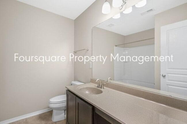 Building Photo - Charming Townhome with Open Layout, Back Patio & One-Car Garage – Near RTP, RDU & Everyday Conven...