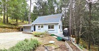Building Photo - Private Wooded Retreat on 2 Acres – 4BR 2Bath Home with Space for Animals, Fruit Trees & Seasonal...