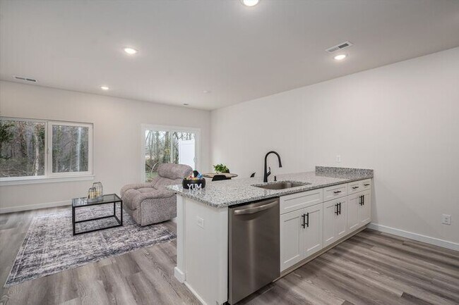 Building Photo - Brand-New Luxury Townhomes – First Month's...