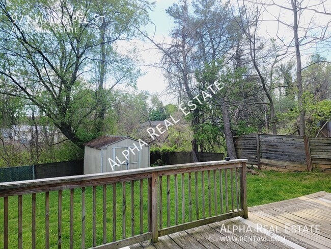Building Photo - Pet friendly home with level fenced back y...