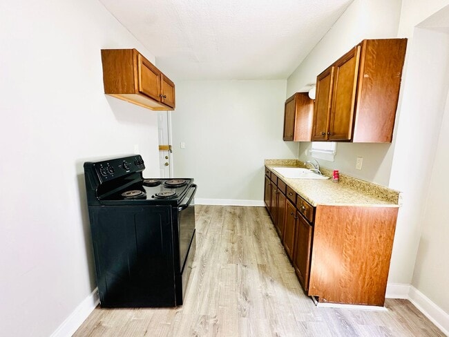 Building Photo - Updated two story home with unfinished bas...