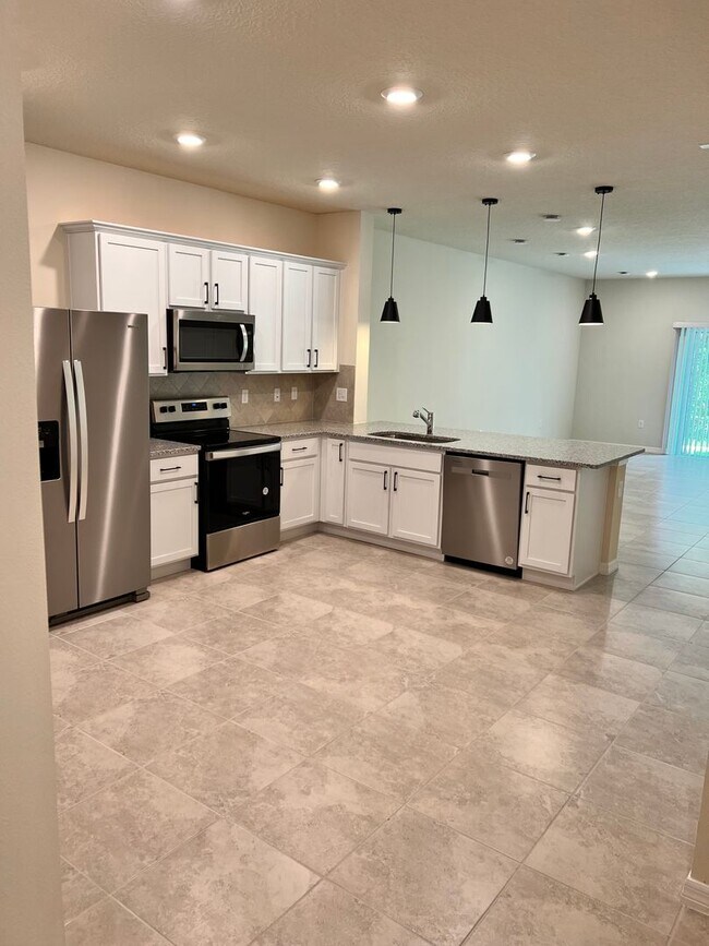 Building Photo - Move In ASAP!! - Brand New 3 bedroom 2.5 bath Townhouse for rent in Kissimmee, FL.