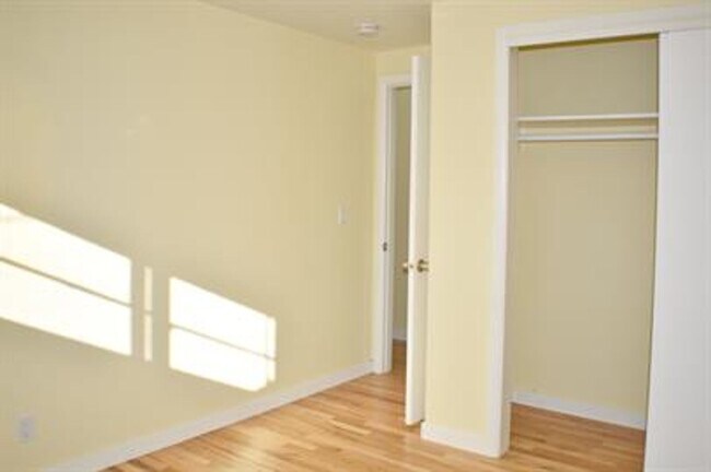 Building Photo - Updated house with original hardwoods and 2-car garage!