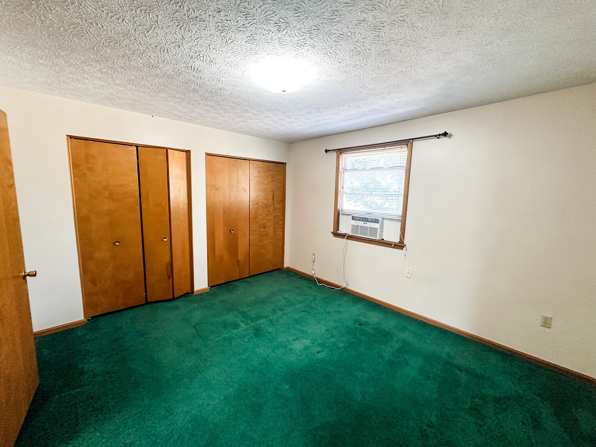 Between bedrooms is the full bath and a large linen closet - 5229 Rule Rd