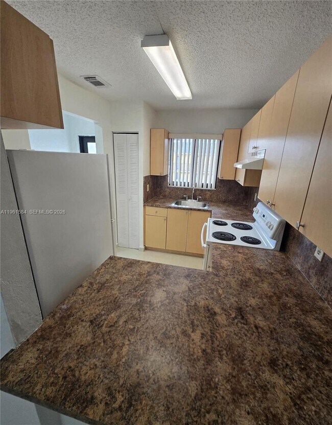 Building Photo - 6151 W 24th Ave