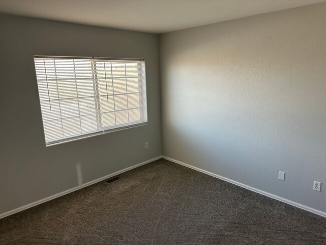 Building Photo - CHARMING 3BD TOWNHOME IN GATED COMMUNITY JUST MINUTES FROM PETERSON AFB & FORT CARSON - Security ...