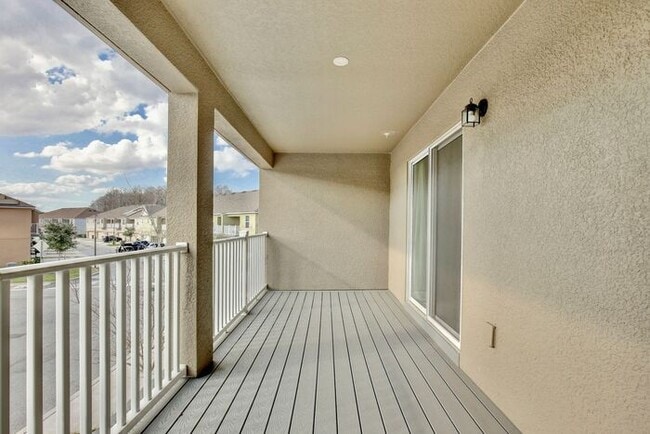 Building Photo - Luxurious 3/2.5 Modern Townhome with a Private Balcony and a 2 Car Garage in the Exclusive Gated ...