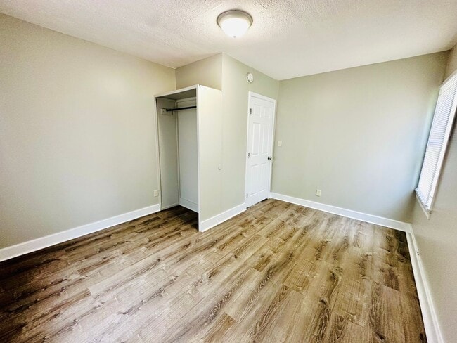 Building Photo - Updated two story home with unfinished bas...