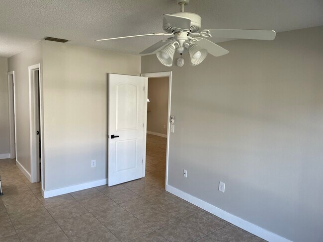 MBR standing at windows/ bath hall and entry door - 2919 Wainwright Ct