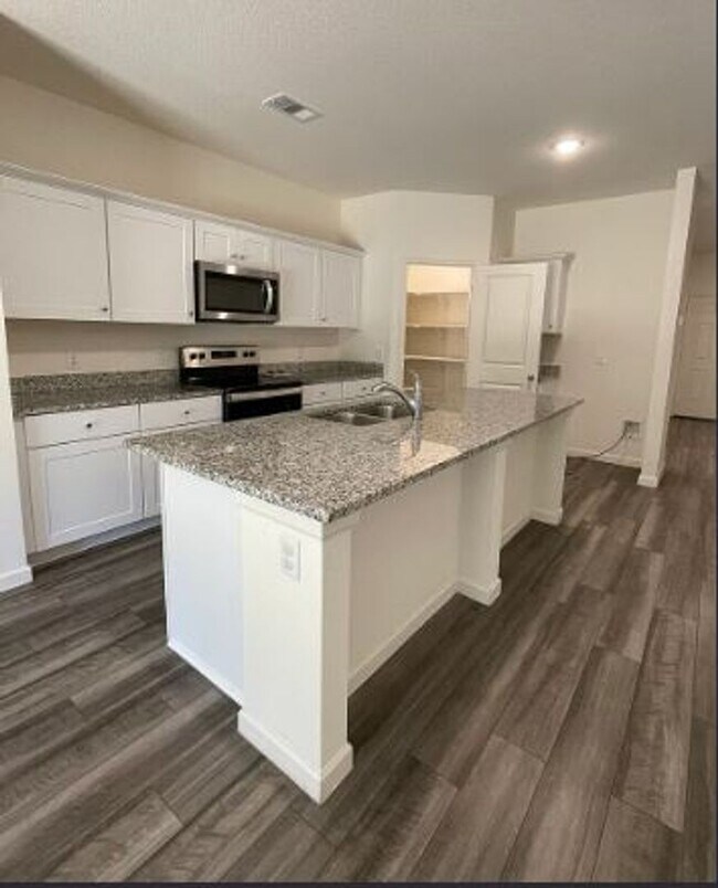 Building Photo - Backs to Wooded Area • Split Bedrooms • Modern & All-Electric