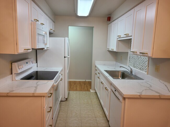 Kitchen with new cabinetry and counters - 11010 NE 68th St