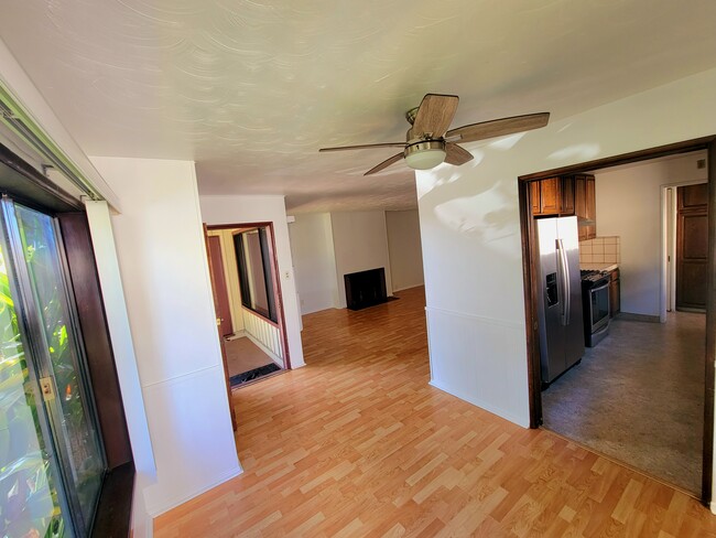 View from DINING room to entry/living room on left and entry to Kitchen on the right. - 12051 Alberta Dr