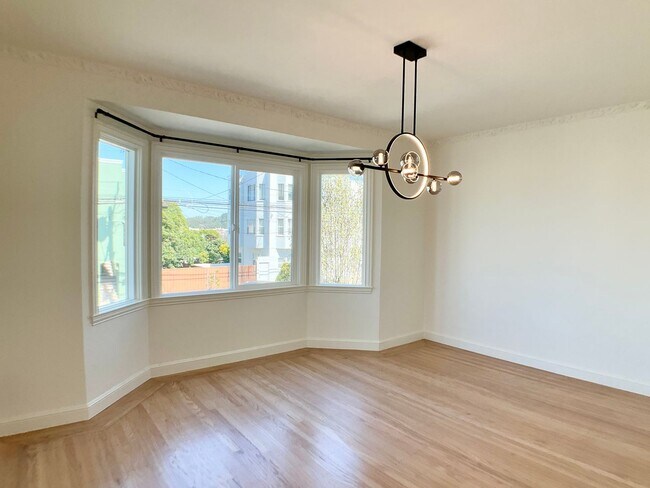 Building Photo - Remodeled! GARAGE PARKING Included! IN-UNI...