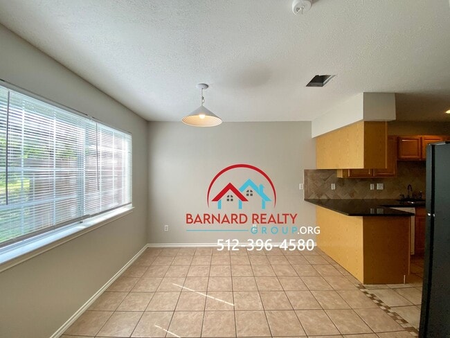 Building Photo - Available July 11: 3 bedroom, 2.5 Bath Duplex with Garage and Fenced Yard