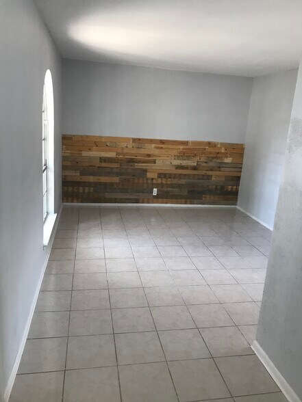 Living room with wooden accent wall - 1338 Churing Dr