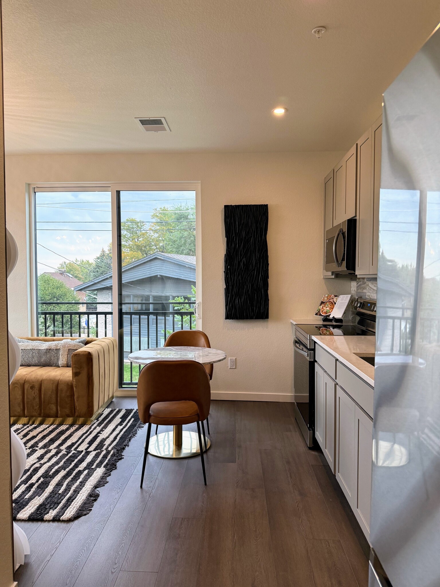 Model Living Room. For display purposes only. Furniture not included and finishes may vary. - 1650 Sheridan Blvd