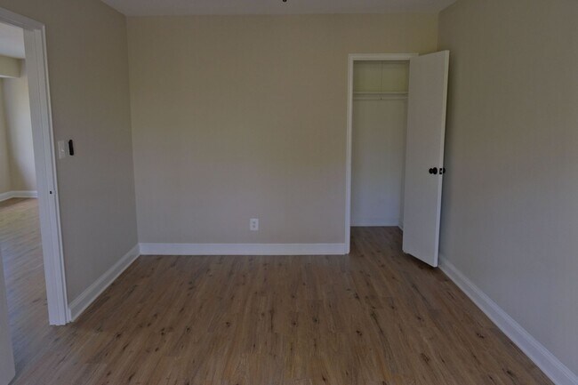 Building Photo - Beautiful corner unit in a secure, all-brick, pet-friendly building