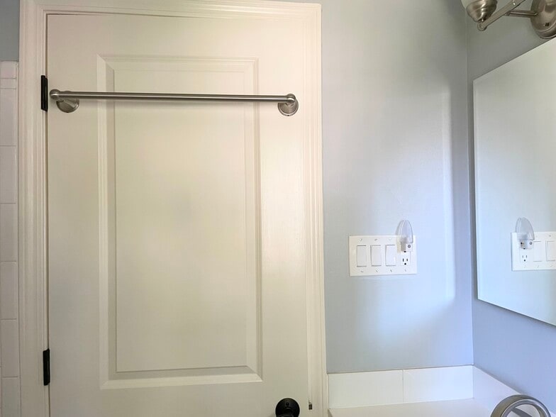 Bathroom door with extra towel hanging - 1620 Graefield Rd