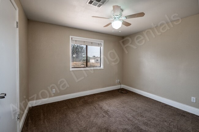 Building Photo - LARGE FENCED YARD WITH DETACHED GARAGE
