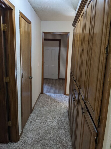 Hallway with lots of cabinets for storage - 1616 Julie Plz