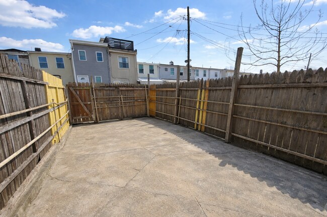 Building Photo - Charming Baltimore Rowhome with Private Backyard & Modern Updates