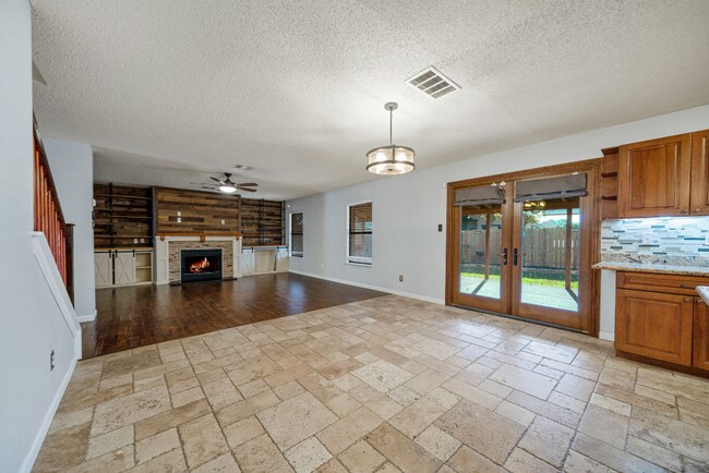 Building Photo - Sign your lease and receive a FREE 50" TV!!!  "Spacious 4-Bedroom Retreat with Fireplace in Charm...